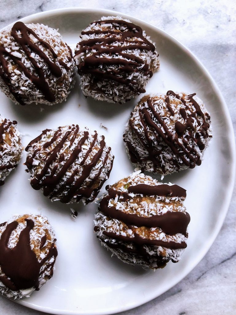 Paleo Gingerbread Coconut Date Balls by Leslie McDonald - FoodSocial