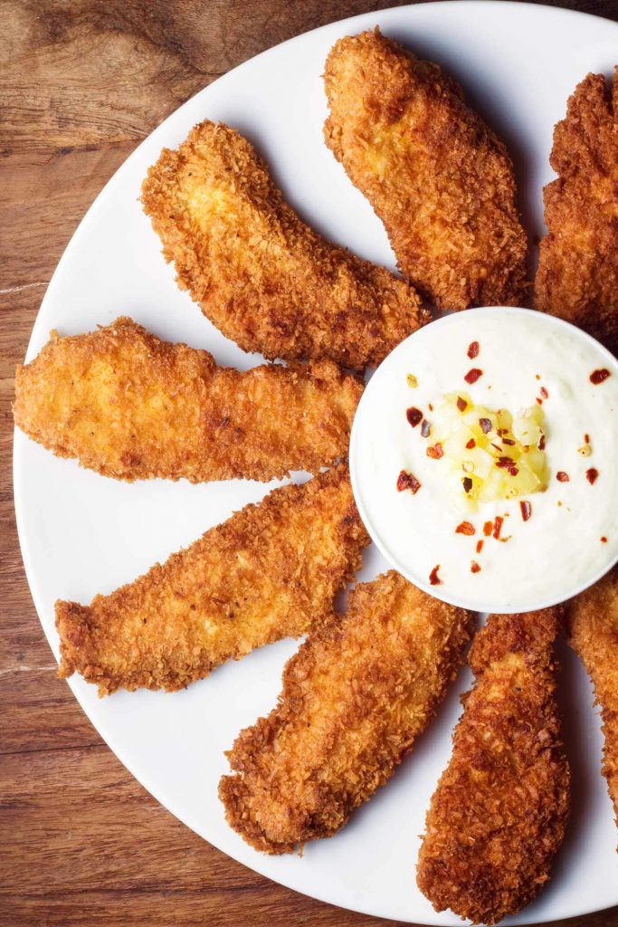 Crispy Coconut Chicken with Piña Colada Dipping Sauce by Kit Hondrum - FoodSocial