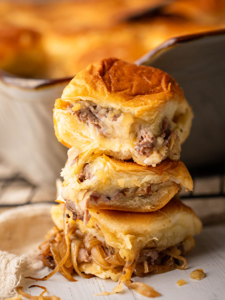 Cheesy Baked Roast Beef Sliders with Caramelized Onions by scarlatifamilykitchen - FoodSocial