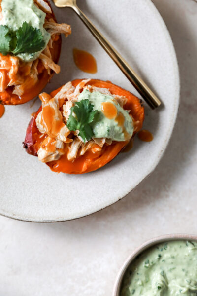 Buffalo Chicken Stuffed Sweet Potatoes with Creamy Avocado Sauce