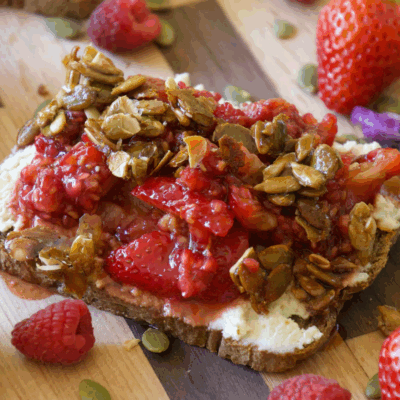 Lavender and Smashed Berry Toast with Whipped Vegan Ricotta and Pumpkin Seed Brittle Crumble