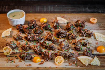 Sticky Cherry Tomato–Grapefruit Glazed Beef Bites with Bacon Crunch